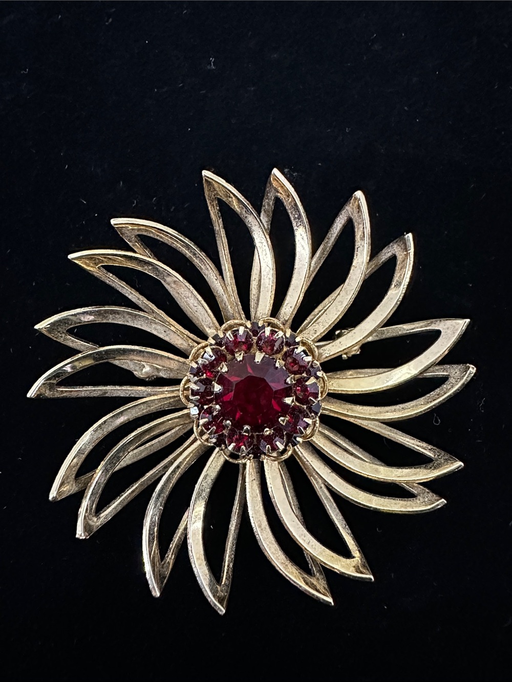 Sarah Coventry Gold Tone Brooch with Deep Red Gem Center